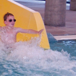 Photo: Kid sliding down the slide at Jim Parsley Community Center